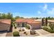 Delightful single-story home boasts desert landscaping, a terracotta roof, and an attached two-car garage for curb appeal at 5332 S Citrus Ct, Gilbert, AZ 85298