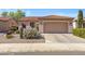 Charming single-story home with a tile roof, desert landscaping, and two-car garage at 5332 S Citrus Ct, Gilbert, AZ 85298