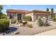 Beautiful front yard with desert landscaping, rocks, and vibrant blooming shrubs at 5332 S Citrus Ct, Gilbert, AZ 85298
