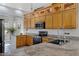 The kitchen features wood cabinetry, granite countertops and stainless steel appliances at 5332 S Citrus Ct, Gilbert, AZ 85298