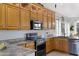 A close-up of the kitchen showcasing granite countertops, stainless steel appliances and wood cabinets at 5332 S Citrus Ct, Gilbert, AZ 85298