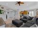 A spacious living room showcases a sectional sofa, ceiling fan and an archway leading into the front entry at 5332 S Citrus Ct, Gilbert, AZ 85298