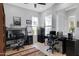 Functional home office setup with two workspaces, neutral walls, and tile flooring at 5332 S Citrus Ct, Gilbert, AZ 85298