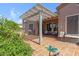Relaxing outdoor patio area with a pergola, tile flooring, comfortable seating and views of vibrant plants at 5332 S Citrus Ct, Gilbert, AZ 85298