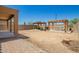Expansive backyard featuring multiple pergolas, with ample space for outdoor entertaining, gardening, and recreation in the desert landscape at 7112 N 126Th Ln, Glendale, AZ 85307