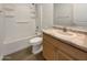 Bathroom with a shower-tub combo and vanity featuring light countertops and wood cabinets at 7146 E Bobwhite Ct, San Tan Valley, AZ 85143