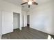 Bedroom with a ceiling fan, closet, and neutral color palette, perfect for relaxation at 7146 E Bobwhite Ct, San Tan Valley, AZ 85143