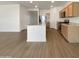 Modern kitchen with an island, stainless steel appliances, wood cabinets and generous counter space at 7146 E Bobwhite Ct, San Tan Valley, AZ 85143