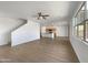 Spacious living room featuring wood flooring and ample natural light with views of the kitchen area at 7146 E Bobwhite Ct, San Tan Valley, AZ 85143