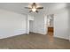 Clean, minimalist main bedroom with wood floors and an ensuite bathroom, awaiting personal touches at 7146 E Bobwhite Ct, San Tan Valley, AZ 85143