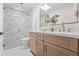 Well-lit bathroom featuring a walk-in shower and a double vanity at 7648 N Via Del Paraiso --, Scottsdale, AZ 85258