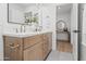 Modern bathroom features a double sink with a wood vanity and large mirror at 7648 N Via Del Paraiso --, Scottsdale, AZ 85258