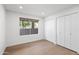 Bedroom includes hardwood floors, a side yard view, and double door closets at 7648 N Via Del Paraiso --, Scottsdale, AZ 85258