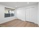 Light-filled bedroom with hardwood floors and a closet provides ample storage solutions at 7648 N Via Del Paraiso --, Scottsdale, AZ 85258