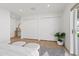 Bright bedroom featuring hardwood floors, large closets, and glass sliding door at 7648 N Via Del Paraiso --, Scottsdale, AZ 85258