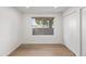 This bedroom has hardwood floors, a window overlooking the side yard, and a large closet at 7648 N Via Del Paraiso --, Scottsdale, AZ 85258
