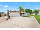 Charming single-story home with a well-manicured front yard, two car garage and desert landscaping at 7648 N Via Del Paraiso --, Scottsdale, AZ 85258