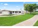 Nice single story home showing lush front yard, desert plants, and close to pathway near mature trees at 7648 N Via Del Paraiso --, Scottsdale, AZ 85258