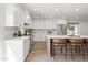 Bright kitchen with white cabinetry, stainless steel appliances, and a marble backsplash at 7648 N Via Del Paraiso --, Scottsdale, AZ 85258