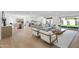 Bright, open-concept living room with hardwood floors, modern furnishings, and access to backyard at 7648 N Via Del Paraiso --, Scottsdale, AZ 85258