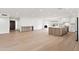 Spacious living area featuring a modern kitchen, elegant fireplace, and bright, open layout at 7648 N Via Del Paraiso --, Scottsdale, AZ 85258