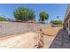 Private backyard enclosed by a block wall, showcasing potential for landscaping and outdoor enjoyment at 8020 W Windrose Dr, Peoria, AZ 85381