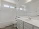 Bright bathroom featuring a shower-tub combo and vanity with modern fixtures at 8020 W Windrose Dr, Peoria, AZ 85381