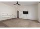 Bonus room with ceiling fan and carpet at 8020 W Windrose Dr, Peoria, AZ 85381