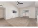 A bonus room with a ceiling fan and sliding glass door at 8020 W Windrose Dr, Peoria, AZ 85381