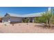 Single-story home with a desert landscape at 8020 W Windrose Dr, Peoria, AZ 85381