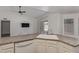 An airy kitchen space with white cabinets, stainless steel appliances, and breakfast bar at 8020 W Windrose Dr, Peoria, AZ 85381