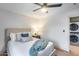 Comfortable bedroom featuring modern decor, a ceiling fan, and easy access to the laundry room at 8117 E Lewis Ave, Scottsdale, AZ 85257