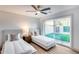 Bright bedroom with twin beds and a sliding glass door that offers seamless access to the outdoor space at 8117 E Lewis Ave, Scottsdale, AZ 85257