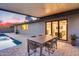 Covered patio offers an excellent outdoor dining area next to pool and home at 8117 E Lewis Ave, Scottsdale, AZ 85257