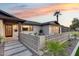 Charming home with a decorative block fence and updated front door and garage at 8117 E Lewis Ave, Scottsdale, AZ 85257
