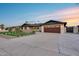 Charming single-Gathering home featuring a well manicured lawn and a 2 car garage at 8117 E Lewis Ave, Scottsdale, AZ 85257