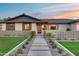 Inviting front entrance with a decorative fence, leading to a modern style front door at 8117 E Lewis Ave, Scottsdale, AZ 85257