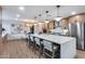Spacious kitchen featuring a large island with bar seating, modern appliances, and sleek cabinetry at 8117 E Lewis Ave, Scottsdale, AZ 85257