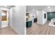 Bright, open-concept living room and kitchen featuring wood floors and contemporary design at 8117 E Lewis Ave, Scottsdale, AZ 85257
