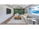 Bright living room boasts a large sectional, modern decor, and a feature wall for a contemporary design at 8117 E Lewis Ave, Scottsdale, AZ 85257