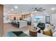 Large open-concept living space featuring a kitchen, dining, and living area with wood floors and modern design at 8117 E Lewis Ave, Scottsdale, AZ 85257