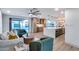 Large open-concept living space featuring a kitchen, dining, and living area with wood floors and modern design at 8117 E Lewis Ave, Scottsdale, AZ 85257