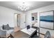 Bright home office with modern decor, desk, and chair, and a view into the bedroom at 8117 E Lewis Ave, Scottsdale, AZ 85257