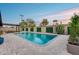 Relaxing pool with covered seating area, turf lawn, and privacy wall; ready for summer at 8117 E Lewis Ave, Scottsdale, AZ 85257