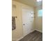 Small bathroom with light-colored walls, light wood-look flooring, and white door at 930 W Mackenzie Dr, Phoenix, AZ 85013