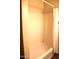 Clean bathroom featuring a bathtub with shower curtain and neutral walls at 930 W Mackenzie Dr, Phoenix, AZ 85013