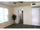 Neutrally painted bedroom with gray wood-look flooring and large window at 930 W Mackenzie Dr, Phoenix, AZ 85013