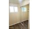 Bright bedroom featuring a closet with mirrored doors and a window for natural light at 930 W Mackenzie Dr, Phoenix, AZ 85013