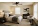 Cozy bedroom featuring a comfortable bed, soft lighting, and a serene atmosphere for relaxation at 930 W Mackenzie Dr, Phoenix, AZ 85013