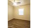 Cozy bedroom featuring neutral colors, a ceiling fan, and wood-look vinyl flooring at 930 W Mackenzie Dr, Phoenix, AZ 85013